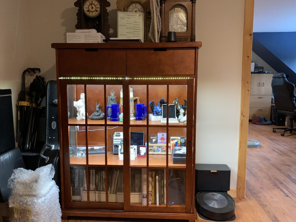 Display cabinet with small trinkets and collectable items